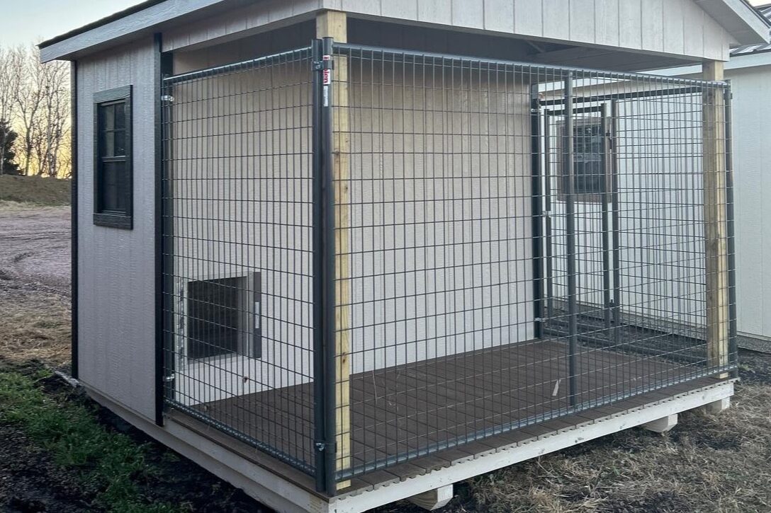 10x10 Dog Kennel with beige siding, black trim and black asphalt shingle roof available for custom order to Aberdeen, SD
