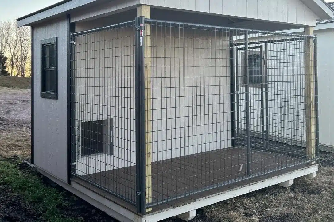 10x10 Dog Kennel with beige siding, black trim and black asphalt shingle roof available for custom order to Aberdeen, SD