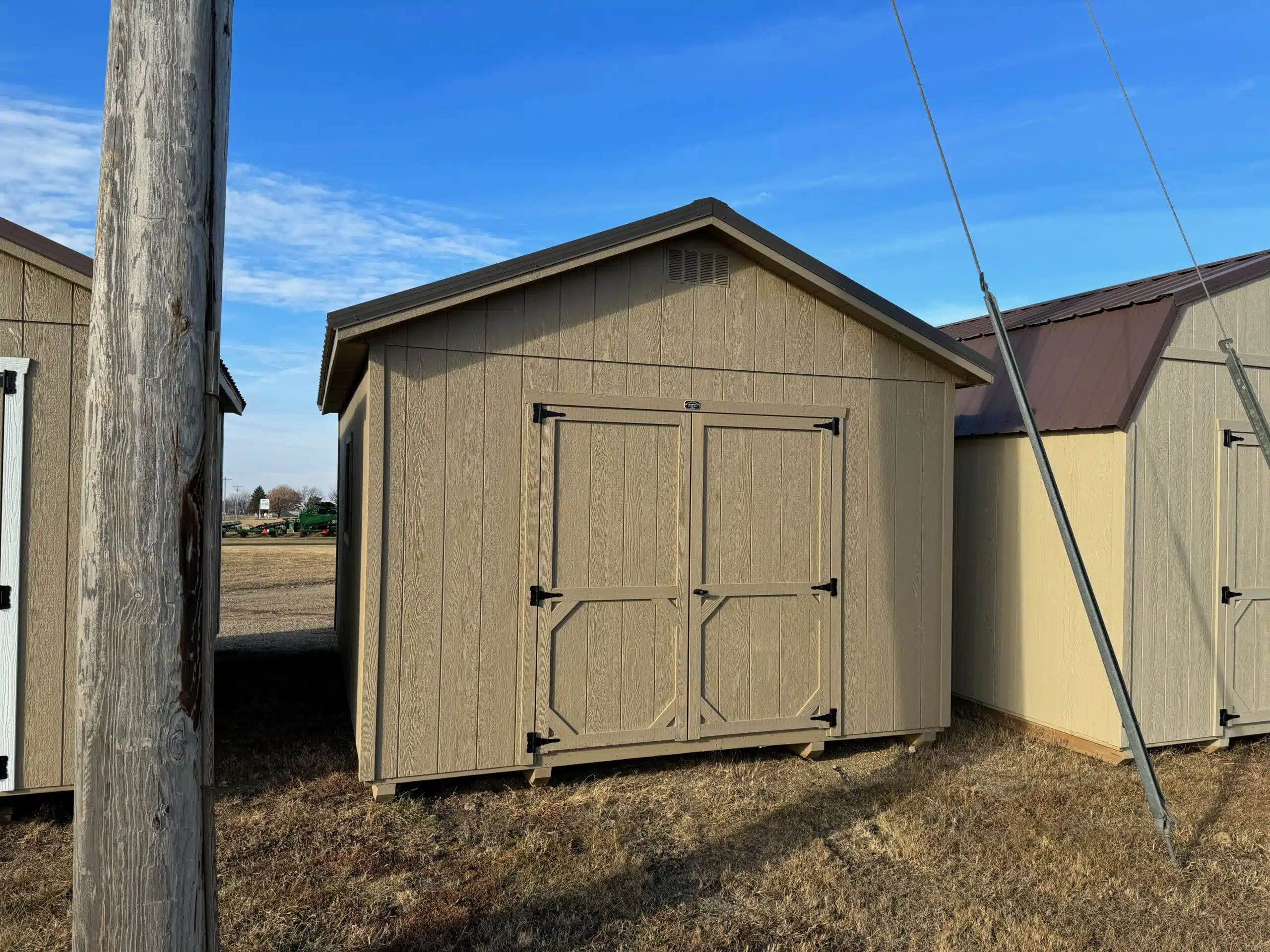 Tan Ranch shed in shed lot