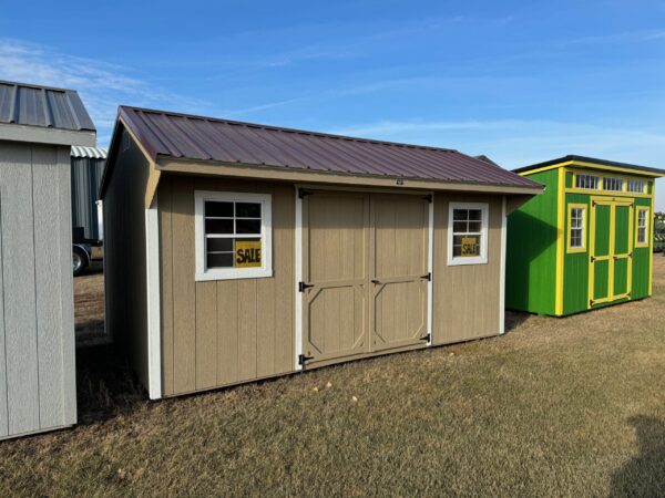 Tan Quaker shed in shed lot