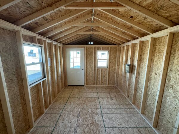 Taupe Ranch shed with end porch in shed lot