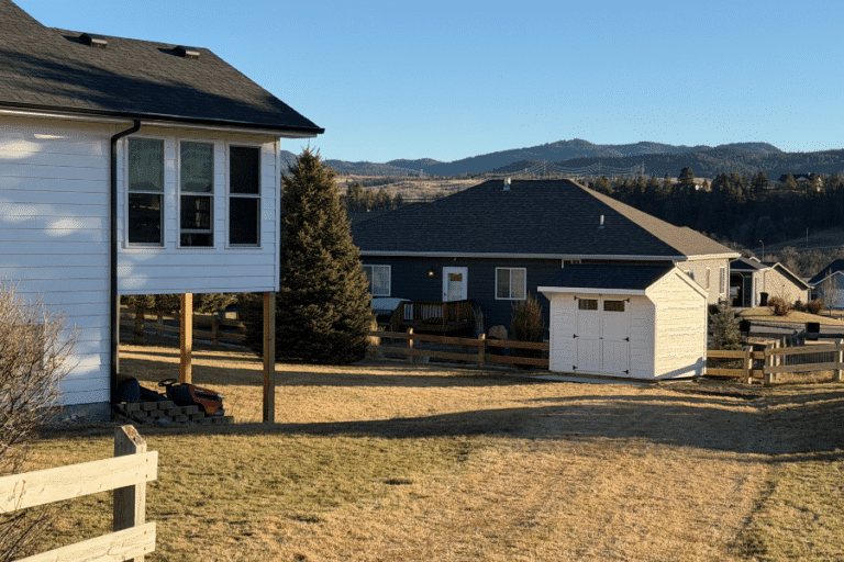 8x12 Quaker Shed in Spearfish, SD with white siding and black shingles
