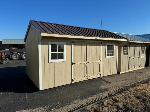 Beige Quaker shed in shed lot