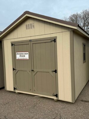 Beige Ranch shed in shed lot
