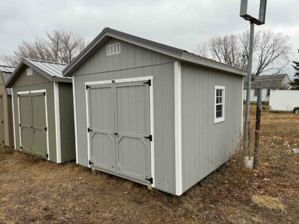 Grey Quaker shed in shed lot