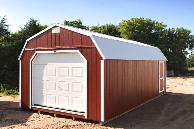 Red high barn ranch garage shed in field