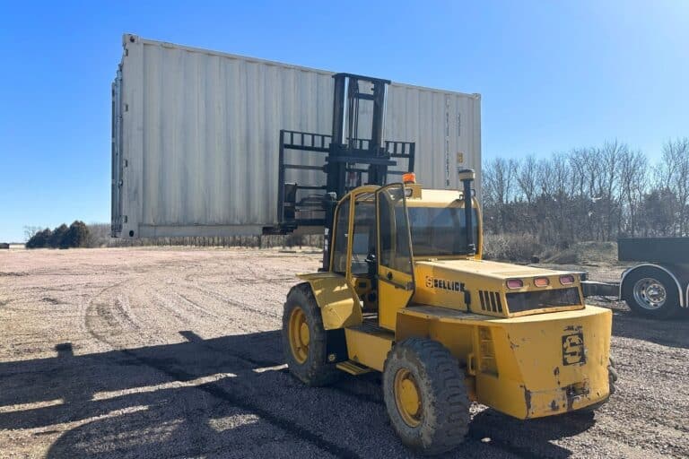 moving a shipping container with a crane